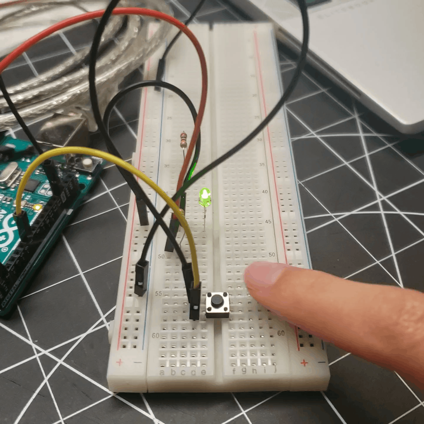 Added a button mechanism to control the bulbs (must be held down to keep the bulbs lit).